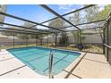 Enjoy the outdoors with this screened-in pool, perfect for relaxation and entertainment in a private backyard at 10512 Red Coach St, Spring Hill, FL 34608