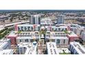 Aerial view of a building with multiple balconies and a rooftop patio at 1208 E Kennedy Blvd # 831, Tampa, FL 33602