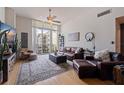 Cozy living room with hardwood floors, a plush rug, and ample natural light at 1208 E Kennedy Blvd # 831, Tampa, FL 33602