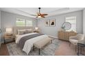 Bright bedroom with a ceiling fan, neutral walls, a bench, and a dresser topped with a mirror at 12713 Whitney Meadow Way, Riverview, FL 33578