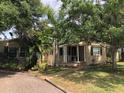 This single-story home boasts a covered front porch, mature landscaping, and a cozy curb appeal at 1508 S Clark Ave, Tampa, FL 33629