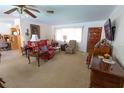 Cozy living room with comfortable seating, a vintage piano, and a bright, airy feel at 2854 60Th N St, St Petersburg, FL 33710