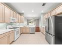 Spacious kitchen featuring modern appliances and plenty of counter space for meal preparation at 30901 Prout Ct, Wesley Chapel, FL 33543