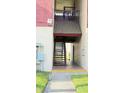 Exterior of a condo showing stairs leading to upper unit at 3829 S Lake Dr # 215, Tampa, FL 33614