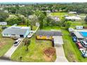Aerial view of the property showing a well maintained yard, boat parking, and carport at 404 12Th Sw St, Ruskin, FL 33570