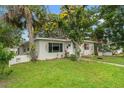Single-story home with a well-maintained lawn, established trees, and a clean, inviting front facade at 4600 Chancellor Ne St, St Petersburg, FL 33703