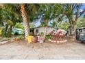 Exterior view of a house with palm trees, highlighting the landscaping and outdoor charm at 5232 72Nd N Way, St Petersburg, FL 33709