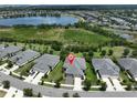 Beautiful aerial view of the home's location within the community, showcasing a nearby lake and well-maintained surroundings at 7406 Parkshore Dr, Apollo Beach, FL 33572