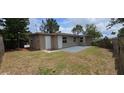 The backyard features a fenced yard, patio, and green space perfect for outdoor activities at 10118 114Th Ter, Largo, FL 33773