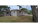 The home's exterior includes well-kept landscaping and a view of the side yard and patio at 10118 114Th Ter, Largo, FL 33773