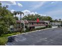 An elevated view of the condo complex, with parking and green spaces surrounding it at 1100 East Bay Dr # 42, Largo, FL 33770