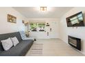 Cozy living room featuring tile floors, bright walls, and plenty of natural light at 11104 Taft Dr, Port Richey, FL 34668
