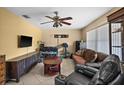 Cozy living room with tile flooring, ceiling fan, and comfortable seating at 1226 Hermitage Ave, Clearwater, FL 33764