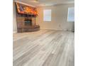 Inviting living room with a brick fireplace and large windows for natural light at 13601 Audrey Ln, Largo, FL 33771