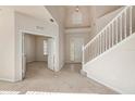Spacious foyer boasting soaring ceilings, a staircase, and access to a study or office at 1605 Acorn Seed Ct, Valrico, FL 33594