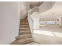 Bright foyer with staircase leading upstairs and open layout to the living area at 1605 Acorn Seed Ct, Valrico, FL 33594