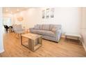Bright living room with a neutral color palette, hardwood floors, and modern furniture at 1933 Oxnard Ct, Tampa, FL 33612