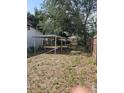 Large backyard with a covered parking area and privacy fence at 1935 W Union St, Tampa, FL 33607