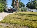 Charming single-story home features a well-manicured lawn and a convenient driveway with ample parking at 310 4Th Sw Ave, Ruskin, FL 33570
