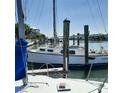 Marina dock featuring sailboats with wooden posts at 319 Boca Ciega Dr, Madeira Beach, FL 33708