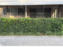 Charming condo exterior featuring lush landscaping, creating a private and serene entrance at 4152 56Th N Way # 513, Kenneth City, FL 33709