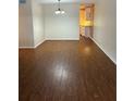 Bright living room featuring sleek, modern flooring and ample space for relaxation and entertainment at 4152 56Th N Way # 513, Kenneth City, FL 33709