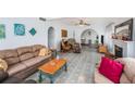 Spacious living room with archways, fireplace, and comfortable seating at 5250 12Th N St, St Petersburg, FL 33703