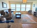 Cozy living room featuring water views and comfortable seating at 5900 Shore S Blvd # 512, Gulfport, FL 33707