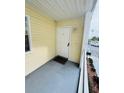 View of outdoor balcony with white railings and a view of the parking lot at 6931 Stones Throw N Cir # 5210, St Petersburg, FL 33710