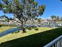 Enjoy scenic marina views from this lush green space, perfect for relaxing and soaking in the tranquil waterside atmosphere at 1125 Pinellas Bayway S # 103, Tierra Verde, FL 33715