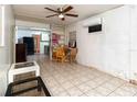 Open living area featuring tile floors and a ceiling fan at 1144 7Th Nw St, Largo, FL 33770