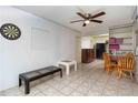 Cozy living room with tile flooring, ceiling fan, and space for dining at 1144 7Th Nw St, Largo, FL 33770