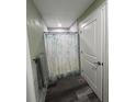 Bathroom showcases a stylish shower curtain, modern flooring, and ample space at 11889 Walker Ave, Seminole, FL 33772