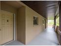 Exterior side view of a condo with a long porch and railing at 1241 S Martin Luther King Jr Ave # 302, Clearwater, FL 33756