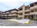 Exterior shot of a condo building featuring parking and walkways with clean landscaping at 1241 S Martin Luther King Jr Ave # 302, Clearwater, FL 33756
