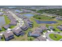 Aerial view of lake community with neighborhood homes and ponds near green space at 12902 Brookside Moss Dr, Riverview, FL 33579