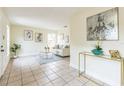 Bright living room with tile floors, neutral walls, and stylish decor at 1818 Kim Acres Ln, Dover, FL 33527