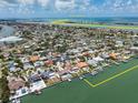 Stunning aerial view showcasing waterfront homes, private docks, and access to the Gulf of America at 191 1St W St, Tierra Verde, FL 33715