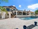 Beautiful backyard featuring a swimming pool, travertine deck and covered patio at 191 1St W St, St Petersburg, FL 33715