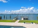 Backyard with expansive waterfront view, boat dock and lift at 191 1St W St, Tierra Verde, FL 33715