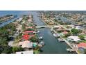 Aerial view of a waterfront home with a pool on a canal system offering boating and scenic views at 2017 Iowa Ne Ave, St Petersburg, FL 33703