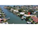 Aerial view of waterfront home with pool and boat dock on a canal with easy access to open waters at 2017 Iowa Ne Ave, St Petersburg, FL 33703