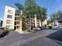Exterior view of the building highlighting the parking and the residential balconies at 2424 W Tampa Bay Blvd # M-201, Tampa, FL 33607