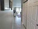 Entrance hallway featuring tile flooring and a view into the living area at 3850 13Th N Ave # 311, St Petersburg, FL 33713