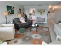 Cozy living room featuring tile flooring, stylish furnishings, and ample natural light at 3850 13Th N Ave # 311, St Petersburg, FL 33713