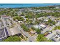 A scenic aerial view shows the home's proximity to shops, waterfront views, and neighborhood charm at 556 Virginia St, Dunedin, FL 34698