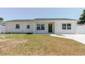 Charming one-story home with a well-manicured lawn, freshly painted exterior, and a new roof at 6110 16Th St, Zephyrhills, FL 33542