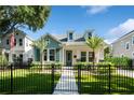 Charming home with manicured lawn, lush landscaping, and a welcoming walkway at 790 36Th N Ave, St Petersburg, FL 33704