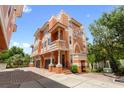 Three story home featuring balconies, columns, and a two-car garage at 904 Villa Venicia Way, Tampa, FL 33606