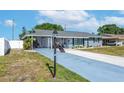 Charming single-story home featuring a well-kept front yard and inviting curb appeal at 906 Hacienda Dr, Sun City Center, FL 33573